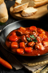 Goulash or Gulasch. Meat stew with carrot, potato, and spices.