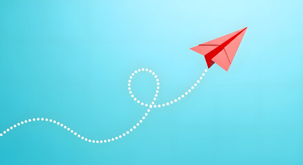 Red paper plane on blue background