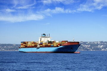 Container ship anchored in the Mediterranean Bay of Naples, Italy.