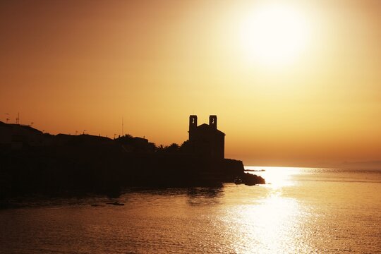 Aerial view during the sunset the antique town of the Tabarca island, in the Mediterranean coast, Alicante, Spain.