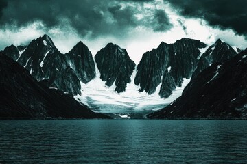 Dramatic glacial mountains reflected in a still lake