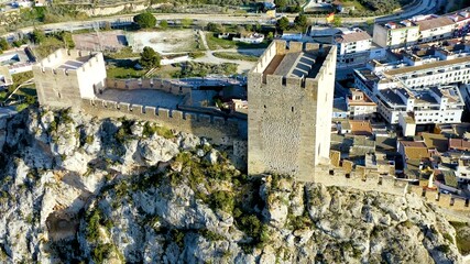 Aerial view of the defensive castle of Sax in a mountain peak in the city center, in Alicante, Spain.