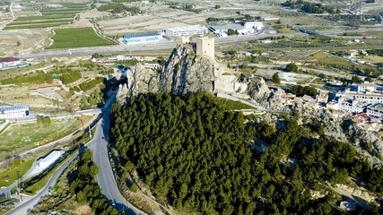 Aerial view of the defensive castle of Sax in a mountain peak in the city center, in Alicante, Spain.