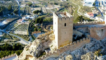 Aerial view of the defensive castle of Sax in a mountain peak in the city center, in Alicante, Spain.