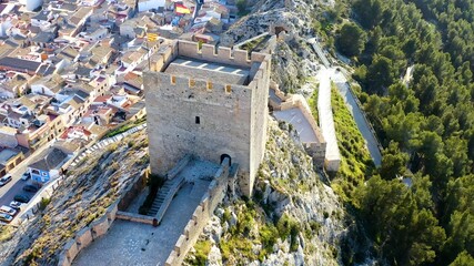 Aerial view of the defensive castle of Sax in a mountain peak in the city center, in Alicante, Spain.