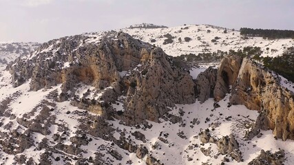 Aerial view of heavy snowfall over the mountains of the village of Castell de Castells in the province of Alicante, Spain.