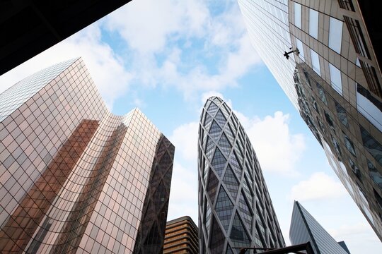 Modern skyscrapers and other business buildings with their glass facades in the La Defense district of Paris, France.