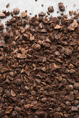 Overhead view of chopped dark chocolate for baking, top view of chocolate chunks