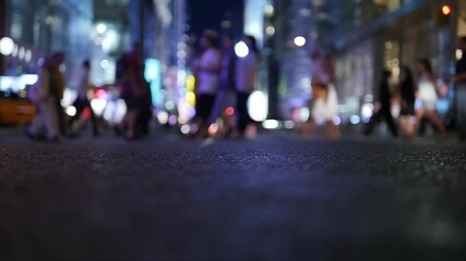 Experience the vibrant energy of urban nightlife filled with busy and lively pedestrians