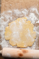 overhead view of tart shell dough rolled out, top view of rolled pie shell dough