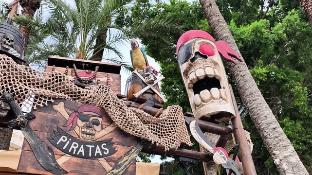 A vibrant piratethemed decoration featuring a colorful tiki totem and tropical elements in a playful setting