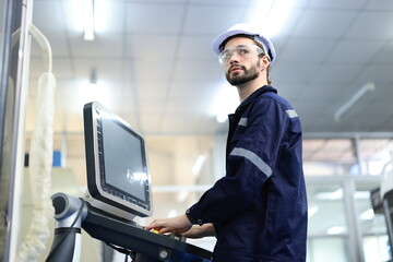 Engineer control machine, factory engineer controlling and pressing important technology button at control panel of an automatic machine in the manufacturing. Robot AI manufacturers.
