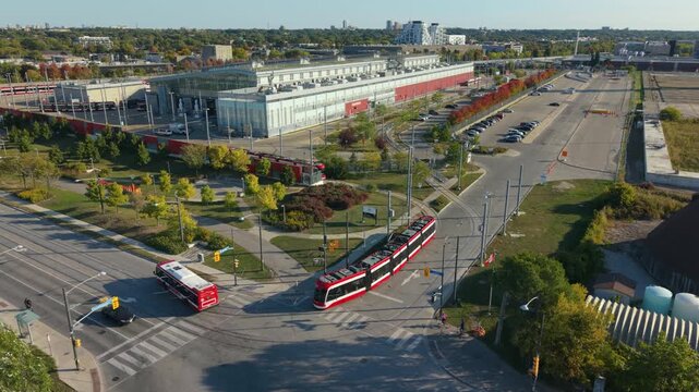 A streetcar pulls out of a maintenance facility to begin service