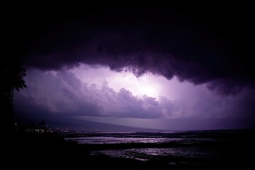 Dramatic purple lightning storm over ocean