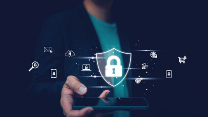 Businessman holding smartphone with glowing security shield lock icon, symbolizing cybersecurity, mobile data protection, online privacy, secure network, e-commerce safety and digital security system.