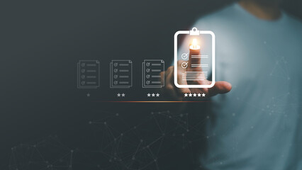 Hand pointing digital checklist document with five star rating, symbolizing quality control, task management, productivity, performance review, evaluation, business success and professional standard.