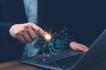 Businessman hand touch digital fingerprint scan on laptop, symbolizing cybersecurity, biometric authentication, identity verification, data protection, privacy, secure login, security technology.