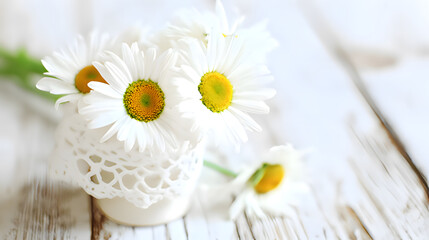 Obraz premium Fresh daisies in a simple white vase, radiating natural charm and understated elegance.
