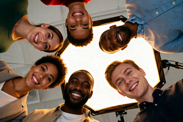 a group of young people with diverse skin tones gathered in a circle, smiling. unity, friendship, inclusivity, and positive social interaction in a warm and uplifting moment.Generated by AI