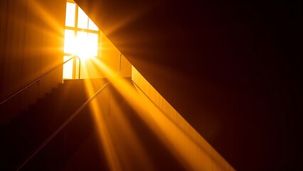 Golden sunlight casting dramatic shadows through an abstract geometric staircase in an architectural setting.