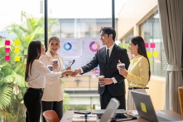Business people shaking hands during meeting in office