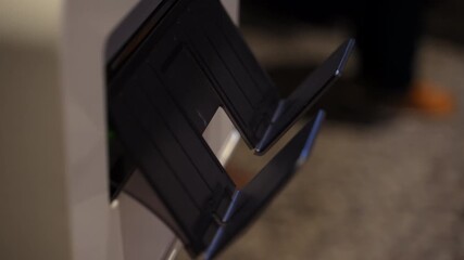 Closeup of colored paper photos printed by digital photo printing machine immediately on the party event