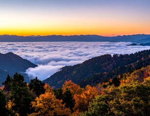 Autumn mist-covered mountains at sunrise