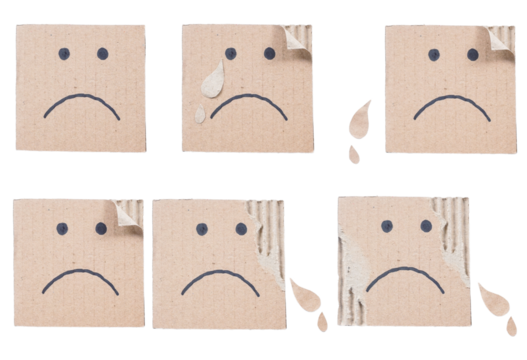 Set collection or collage of hand drawn sad face on a ripped corrugated cardboard box isolated on transparent background