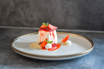 Elegant Panna Cotta Dessert with Fresh Strawberries and Cream