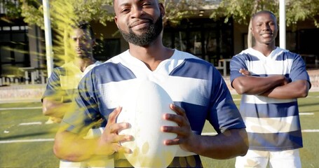 rugby players posing in ad getting yellow powder from right sweeping goalpost revealing team unity - Powered by Adobe