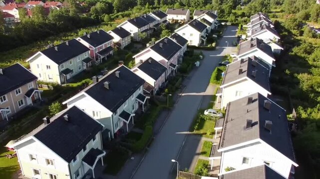 Aerial view of a suburban residential neighborhood in Stockton, California, showcasing rows of single-family homes, streets, and surrounding farmland. Ideal for topics related to urban planning, Calif