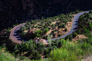 Scenic highway hairpin turn on a sunny summer day in a arid desert southwest environment, Zion...