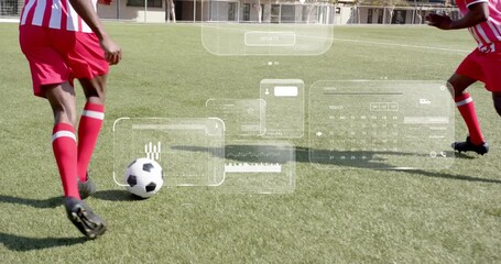 Right player tapping ball toward mate initiating AR panels clustering into data during soccer drill - Powered by Adobe