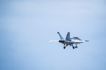 Air show planes flying in formation in blue sky