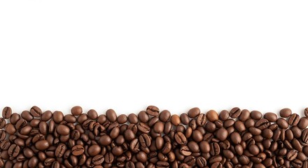 Naklejka premium A simple composition of roasted coffee beans forming a horizontal border at the bottom, isolated on a white background with copy space