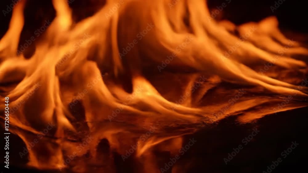Sticker hypnotic fire patterns shimmer on a reflective surface, creating a beautiful, distorted visual contr
