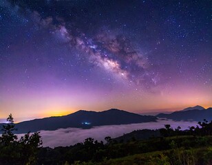 Fototapeta premium Majestic Milky Way Over Misty Mountainscape.