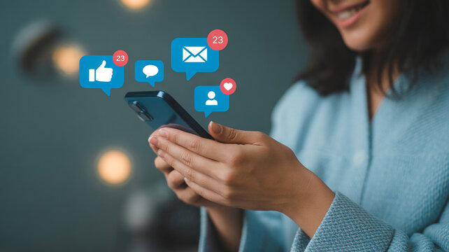 Smiling person engaging with social media notifications on a smartphone