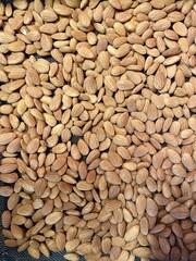 Raw almonds up close and frame filling image for background use