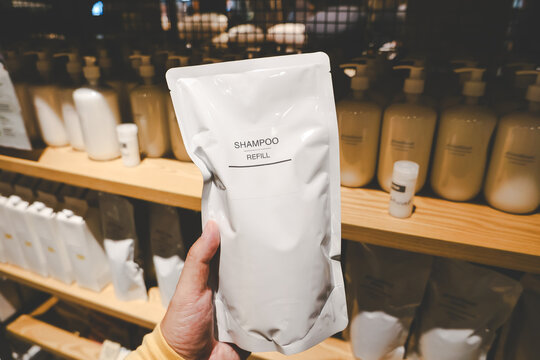 Shampoo Refill in Sustainable Packaging. shampoo refill pouch in a retail store. eco friendly and sustainable product packaging.