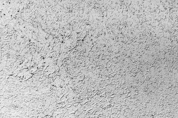 Close-up of textured gray concrete wall surface with rough pattern