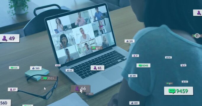Businesswoman starting meeting on laptop while follower, chat, like icons animating near keyboard - Powered by Adobe