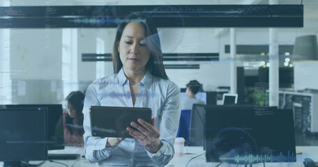 female professional holding tablet in office tapping screen activating data visuals for analytics - Powered by Adobe