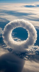 A breathtaking aerial view of a ring-shaped cloud formation, showcasing a unique and mesmerizing spectacle against a backdrop of a vibrant, cerulean sky.