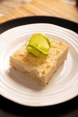 Carlota de Limon, a cold, no-bake dessert made with layers of Maria cookies and a creamy mixture of lemon and condensed milk, an easy homemade recipe very popular in Mexico.