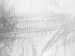 Background texture of plastic bubble wrap used for packing and protecting products from bumps and scratches.