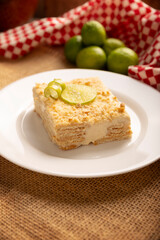 Carlota de Limon, a cold, no-bake dessert made with layers of Maria cookies and a creamy mixture of lemon and condensed milk, an easy homemade recipe very popular in Mexico.