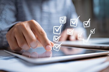 Close-up of hands interacting with a tablet displaying checkmarks, suggesting task completion