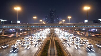 The lively night traffic highlights city lights illuminating the urban landscape - Powered by Adobe