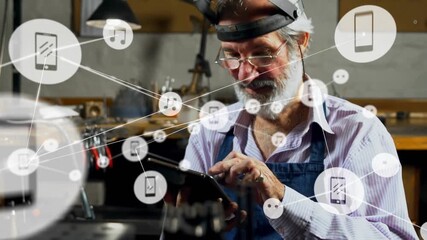 Senior craftsman tapping tablet, generating technology network overlay to explore device links - Powered by Adobe